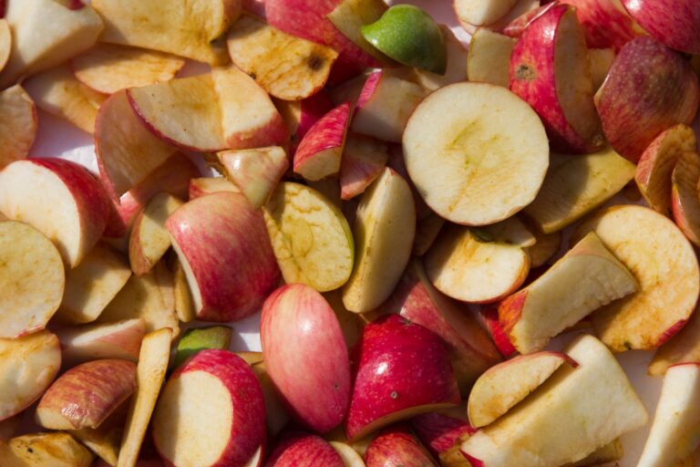 Vibrant apple slices scattered, showcasing fresh texture and color.