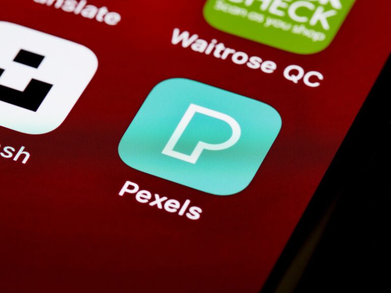 Close-up of various smartphone app icons displayed on a screen, showcasing digital technology and modern lifestyle.