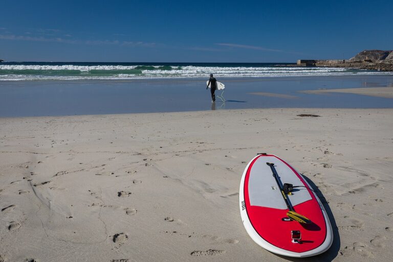 The photograph shows Hoddviksanden beach in Hoddevik on Stadlandet, Stad municipality, Vestland, Norway. The image documents the beach, waves and surfing-…